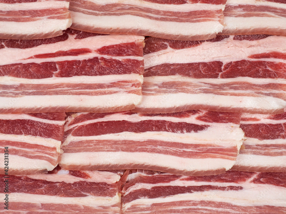 Sliced salted fat with layer of meat background. raw bacon texture. pork Sliced salted fat with layer of meat background. raw bacon texture. pork