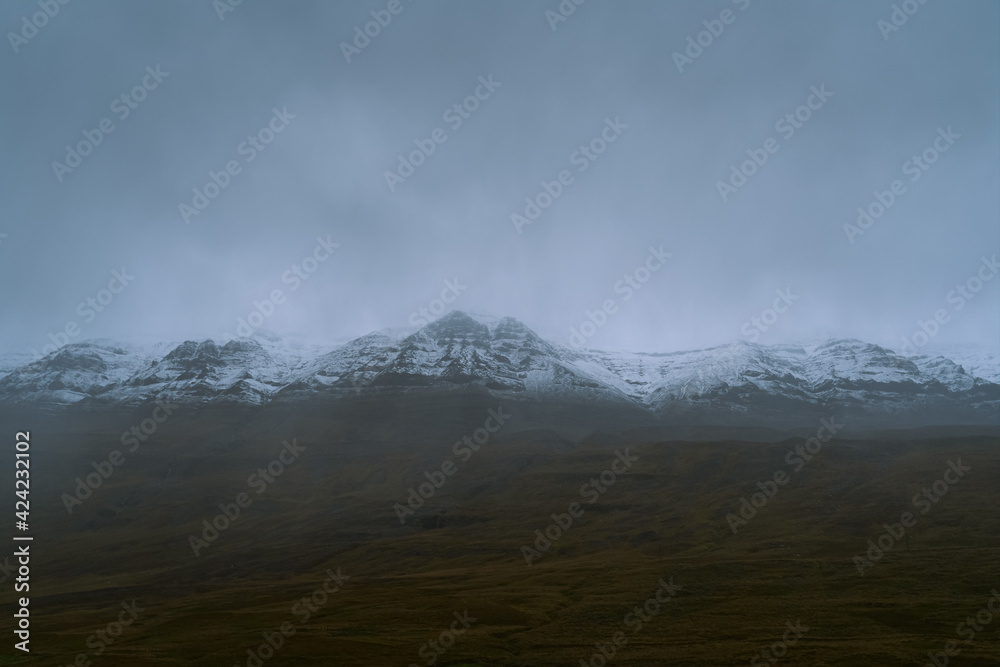 Beautiful nature dramatic landscape in Iceland. Low clouds, fog on the mountains