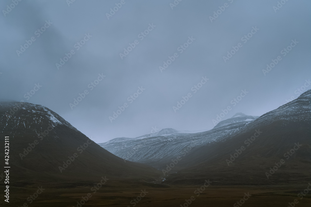 Beautiful nature dramatic landscape in Iceland. Low clouds, fog on the mountains