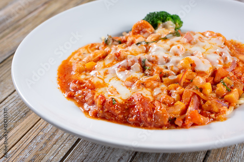 A view of a plate of parmigiana de scampi.