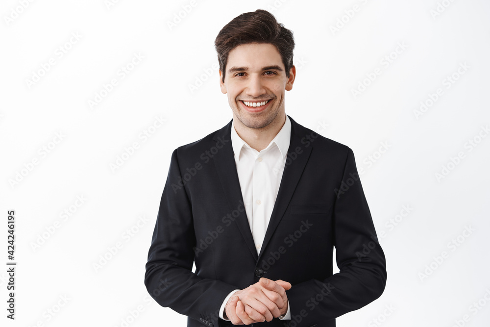 Handsome corporate man, real estate agent assistant smiling, hold hands together, how may I help you, smiling friendly and polite, assist customer, white background Handsome corporate man, real estate agent assistant smiling, hold hands together, how may I help you, smiling friendly and polite, assist customer, white background