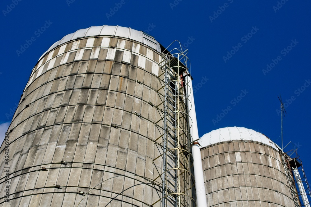 Grain silos against bright blue sky