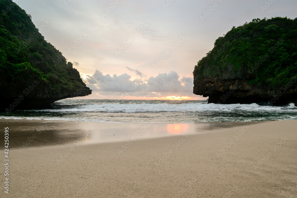 Dusk view in the beach. Greweng Beach, Gunung Kidul Regency, Yogyakarta, Indonesia.