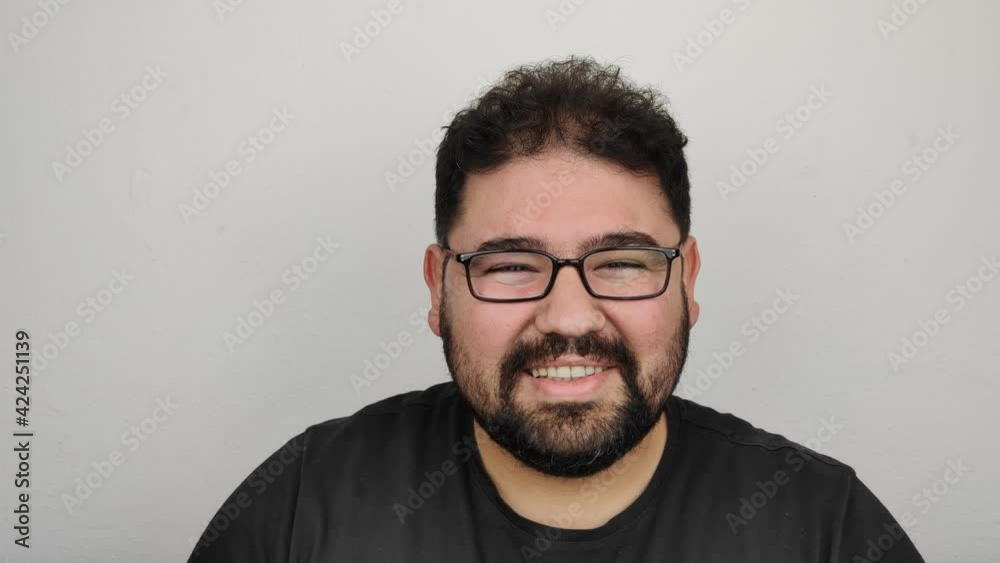 Charismatic man smiling when he saw his acquaintance. Being happy, rejoicing, emotional facial movements Charismatic man smiling when he saw his acquaintance. Being happy, rejoicing, emotional facial movements