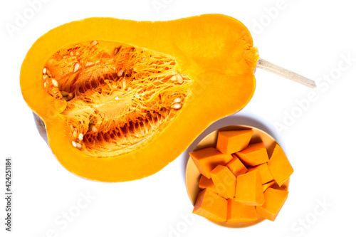 Cutted orange pumpkin. Pieces of sweet pumpki isolated on a white. photo