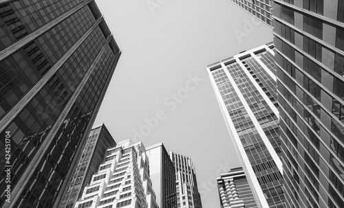 Looking up at Manhattan buildings, black and white picture, New York City, USA.