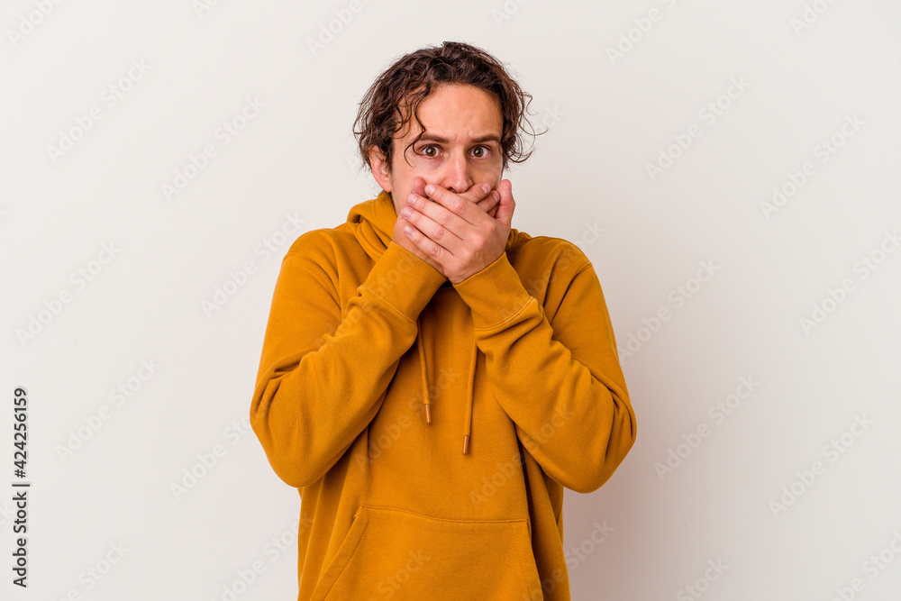 Young caucasian man isolated on white background covering mouth with hands looking worried. Young caucasian man isolated on white background covering mouth with hands looking worried.