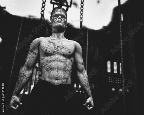 Classic film style black and white of Frankenstein's monster coming alive in Frankenstein's lab photo