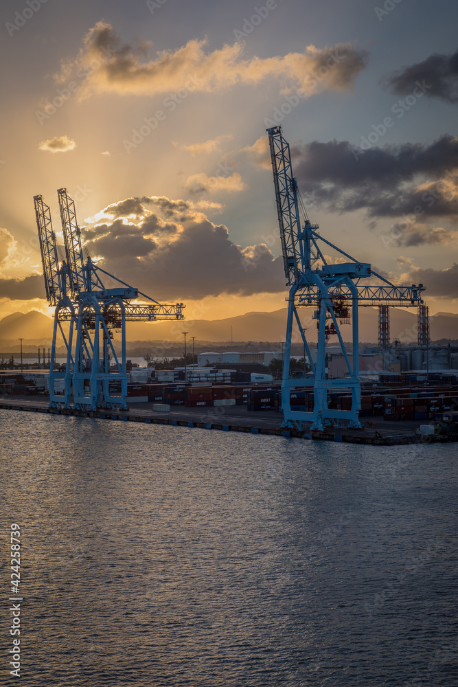 Sun setting over shipping port in Caribbean Island