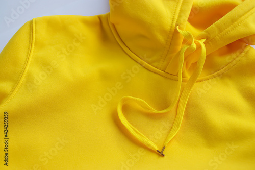 Yellow hoodie close-up.