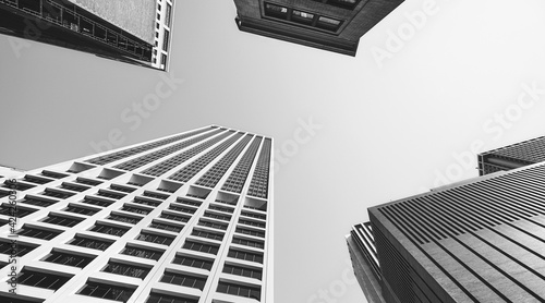 Fototapeta Naklejka Na Ścianę i Meble -  Looking up at New York buildings, black and white picture, USA.