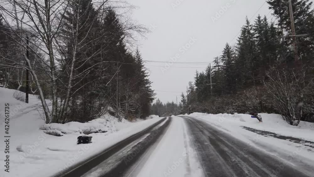Moving driving shot on winter icy road in Alaska. Moving driving shot on winter icy road in Alaska.