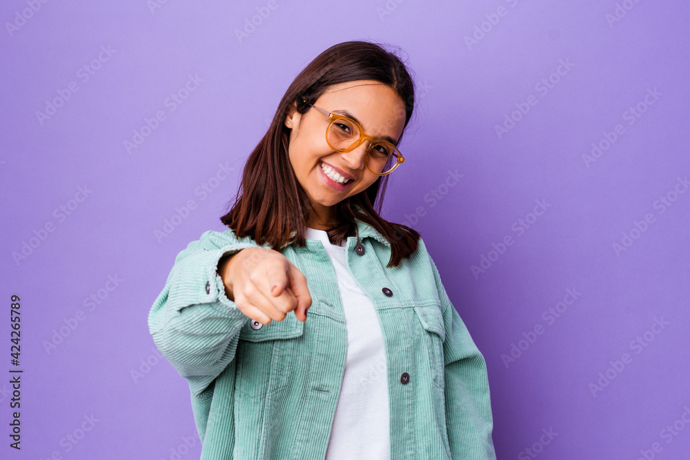 Young mixed race woman isolated cheerful smiles pointing to front. Young mixed race woman isolated cheerful smiles pointing to front.