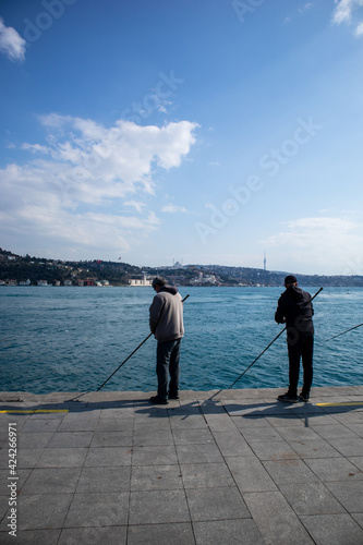 People fishing at Arnavutkoy beach photo