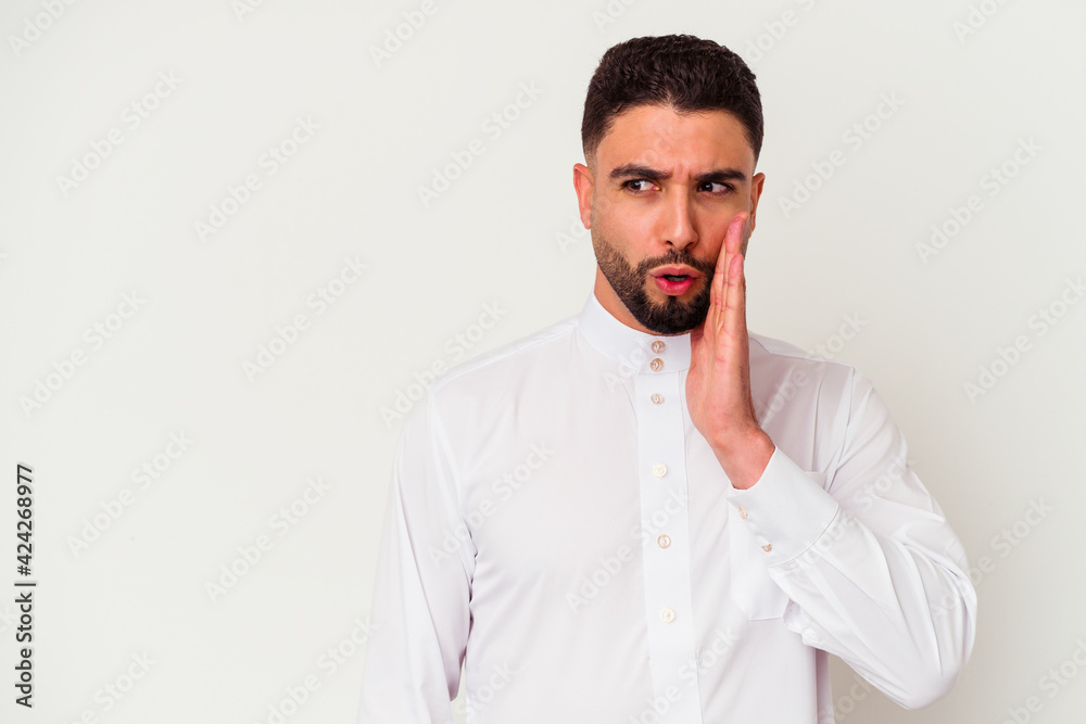 Young arab man wearing typical arab clothes isolated on white background Young arab man wearing typical arab clothes isolated on white background