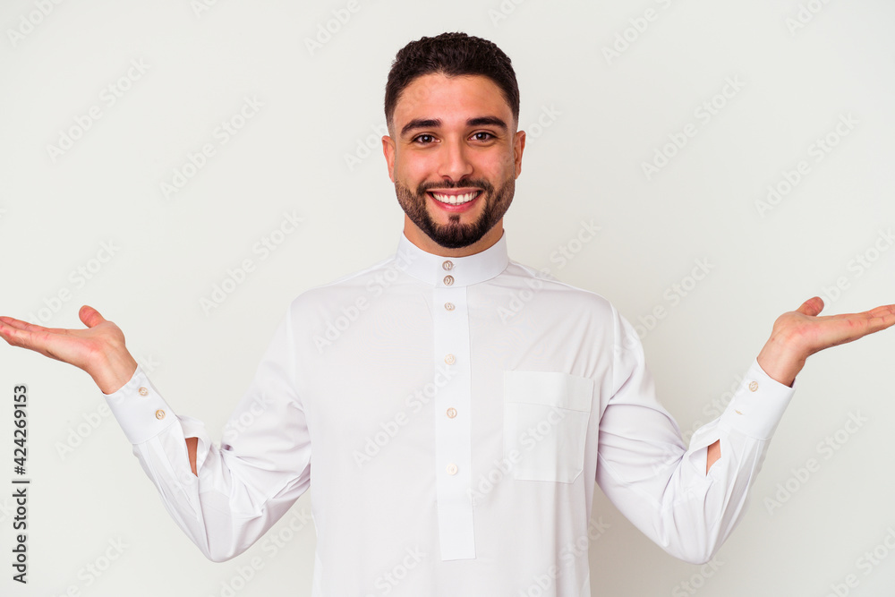 Young arab man wearing typical arab clothes isolated on white background Young arab man wearing typical arab clothes isolated on white background