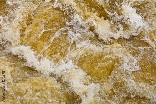 Water turbulent flowing out of the weir