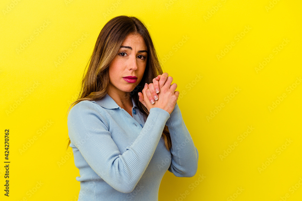 Young caucasian woman isolated on yellow background Young caucasian woman isolated on yellow background
