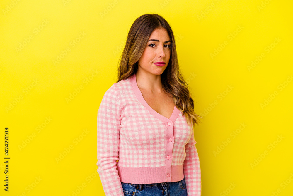 Young caucasian woman isolated on yellow background Young caucasian woman isolated on yellow background