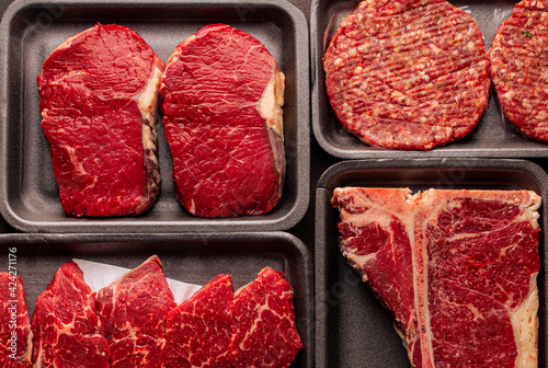 Konstfotografi Black plastic packaging trays from supermarket with different types of fresh raw