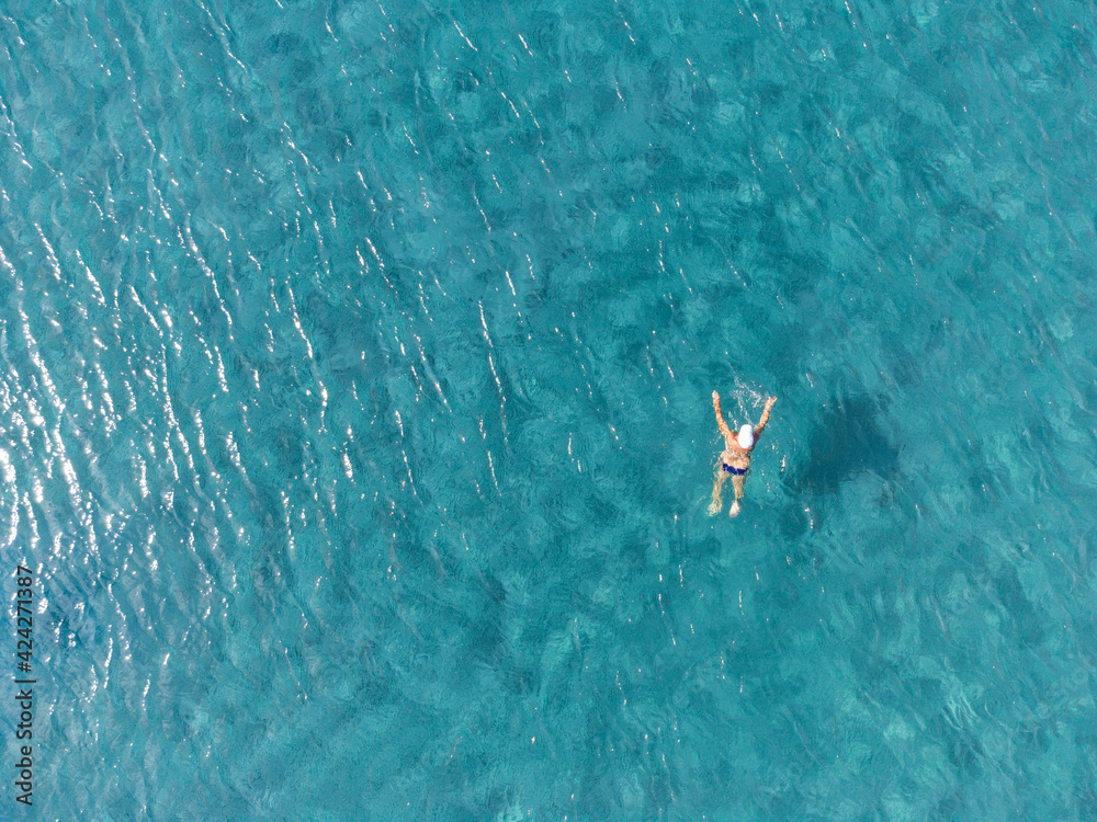 Aerial view of a swimmer at Agia Marina beach, Koropi