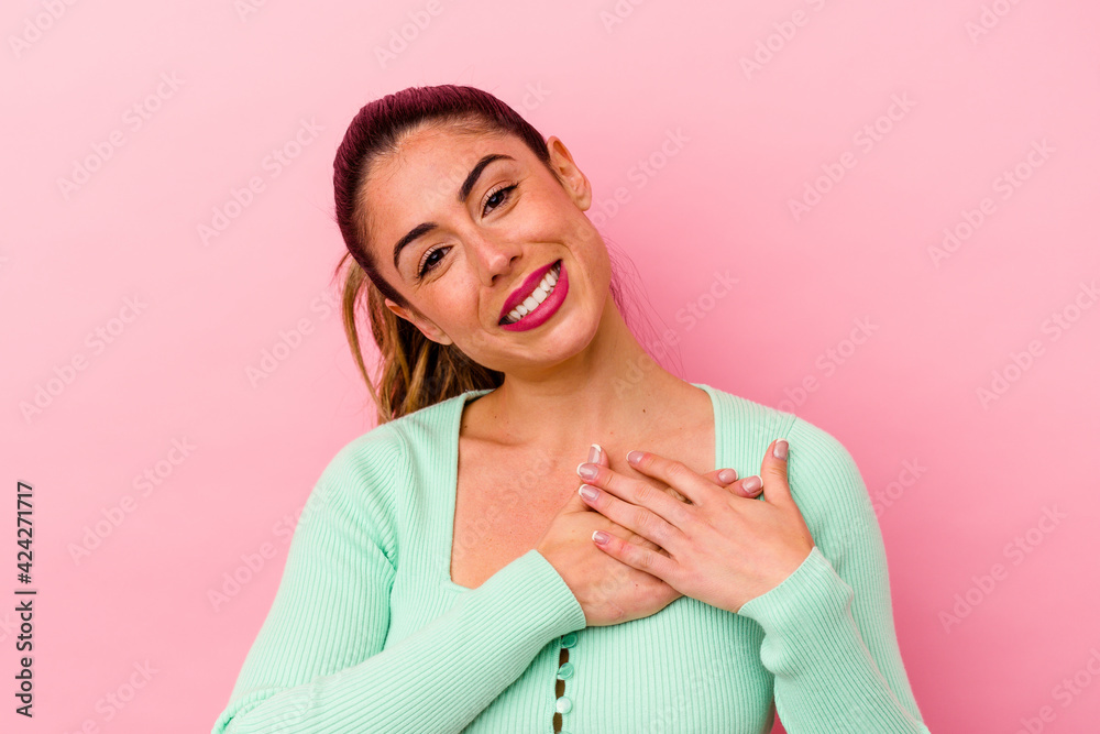 Young caucasian woman isolated on pink background Young caucasian woman isolated on pink background