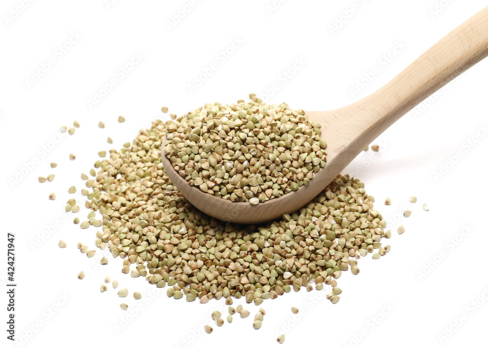 Peeled buckwheat seeds in wooden spoon isolated on white background Peeled buckwheat seeds in wooden spoon isolated on white background