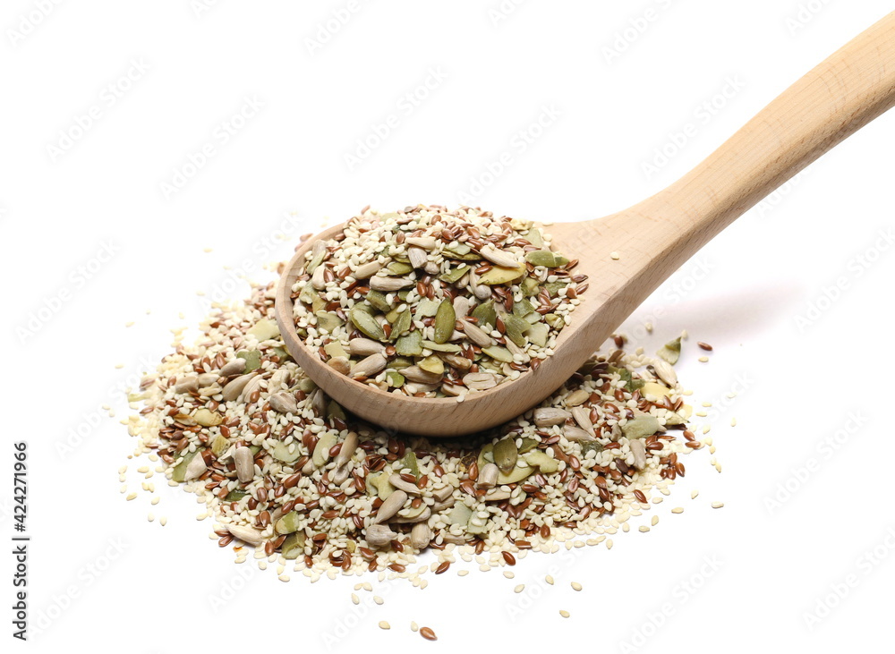 Mixed seeds pile with sunflower, sesame, linseed, pumpkin seed in wooden spoon isolated on white background Mixed seeds pile with sunflower, sesame, linseed, pumpkin seed in wooden spoon isolated on white background