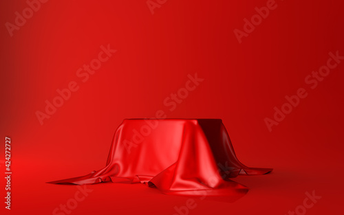 Realistic box covered with red silk cloth isolated on a red background