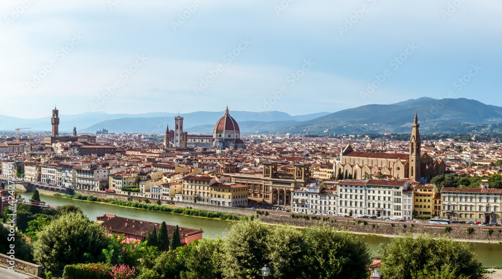 Panorama cityscape of Florence on Arno river. Famous Cathedral of Santa Maria del Fiore, Basilicas, churches etc from Michelangelo terrace square point. Sunny summer day view
