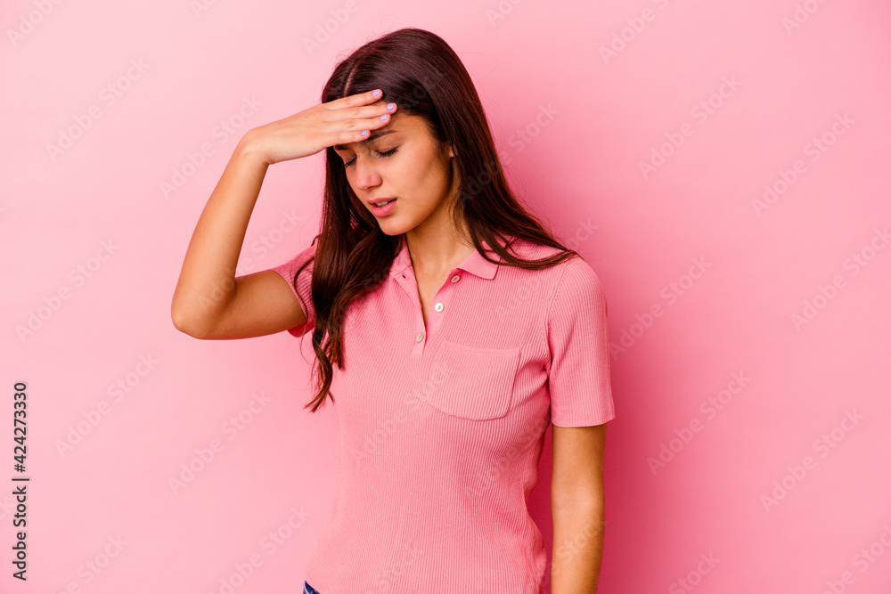 Young Indian woman isolated on pink background touching temples and having headache. Young Indian woman isolated on pink background touching temples and having headache.