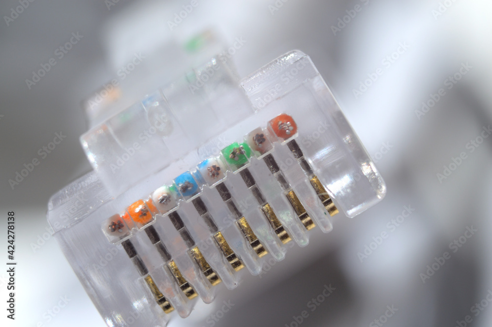 network LAN cable white with a connector rj 45. close-up. network LAN cable white with a connector rj 45. close-up.