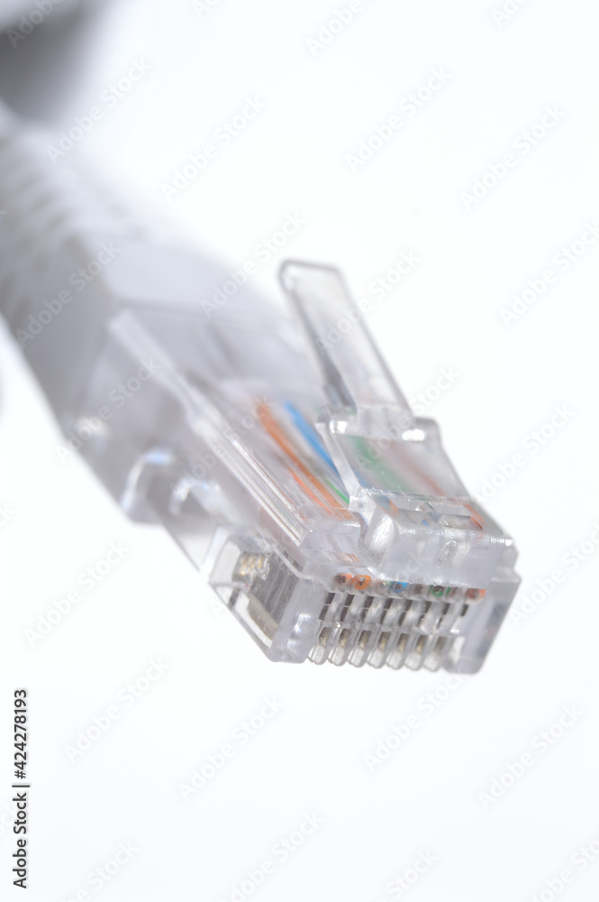 network LAN cable white with a connector rj 45. close-up. network LAN cable white with a connector rj 45. close-up.