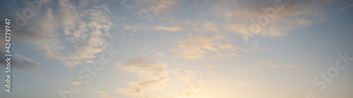Photography Clear blue sky with glowing pink and golden cumulus clouds after storm at sunset