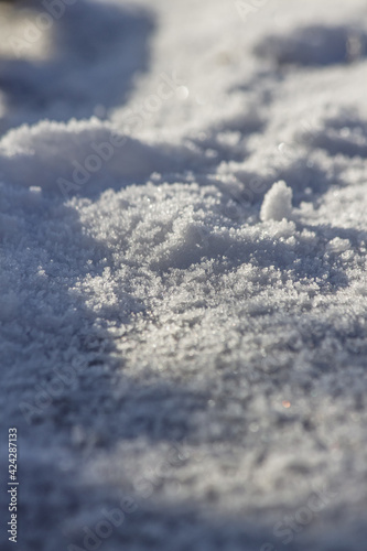 Close up of snow particles and flakes. Winter snow background © Codrin Rusu
