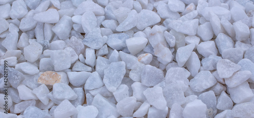 Many white small stones, background from stones