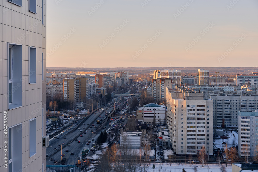 View from above on Amirkhana street in Russian Kazan city. Winter sunny day image. Urban traffic. Concept of Kazan cityscape. Kazan Kremlin view
