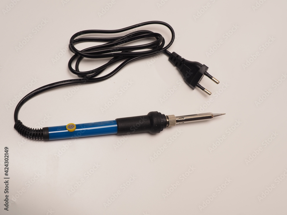 Close up shoot of soldering iron, a tool for soldering electrical components. Shoot on white isolated background