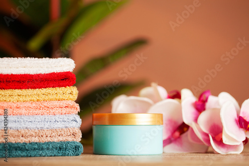 Stack of fresh towels on table in bathroom