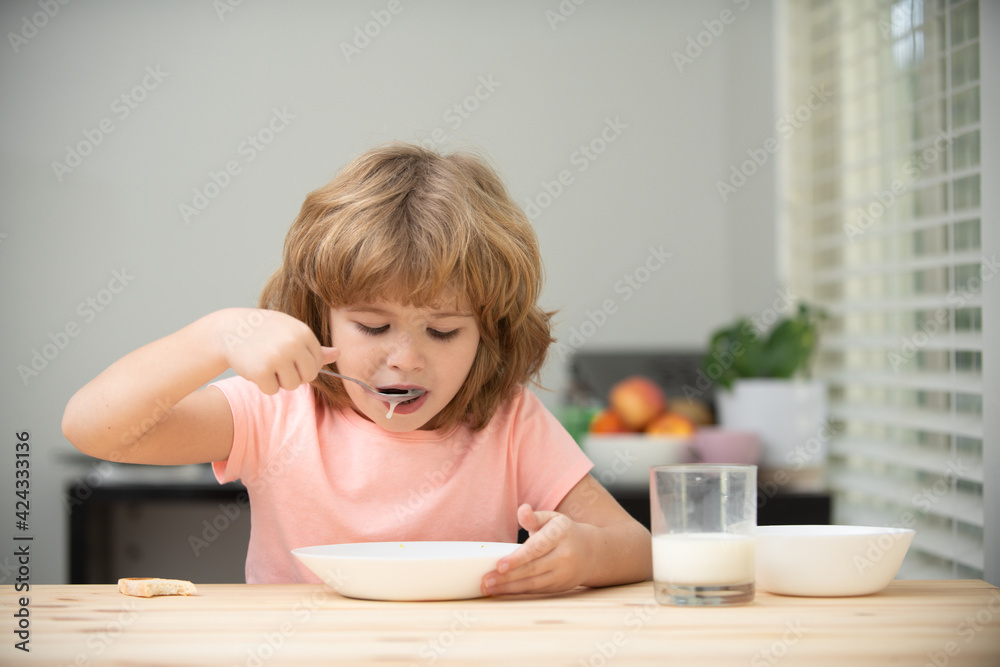 Little healthy hungry baby boy eating soup from with spoon. Child nutrition. Little healthy hungry baby boy eating soup from with spoon. Child nutrition.