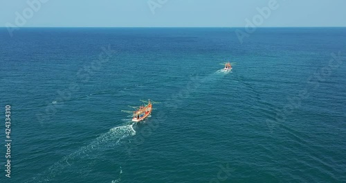 Fishing Boats Aerial View Drone. Small Ships Floats on Sea Surface Leaving a Path of Sea Foam Water