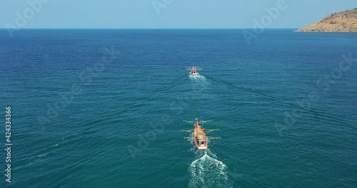 Fishing Boats Aerial View Drone. Small Ships Floats on Sea Surface Leaving a Path of Sea Foam Water