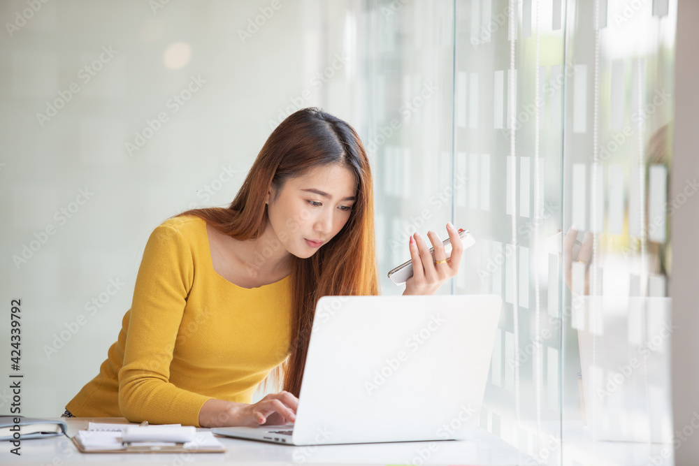 Portrait of Asian young female working on tablet at home office Portrait of Asian young female working on tablet at home office