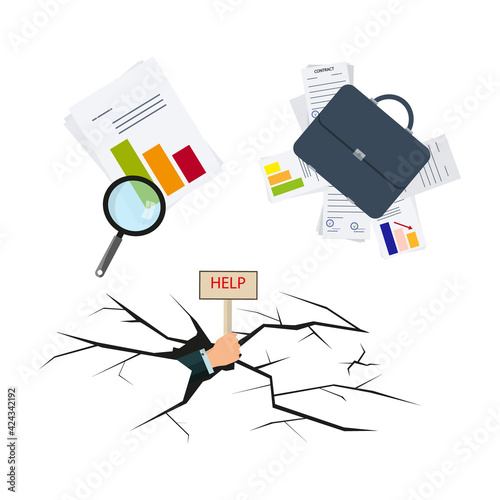 Financial insolvency or bankruptcy. Businessman's hand inside a crack in the ground. Hold a sign that says "Help".Decline, loss charts and briefcase with documents. Business rescue or recovery concept
