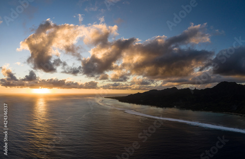 Dramatic aerial panorama of the sunset over the Rarotonga island, the main of the Cook islands archipelago in the south Pacific ocean.