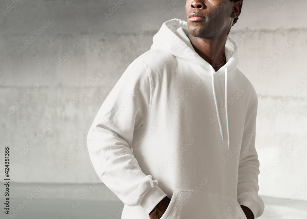 Man in white hoodie and sweatpants men’s fashion apparel shoot Stock  Photo