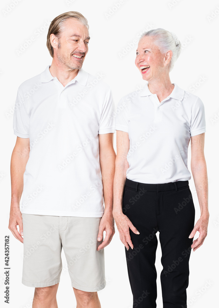 Happy senior couple in white polo shirts with design space studio portrait Happy senior couple in white polo shirts with design space studio portrait
