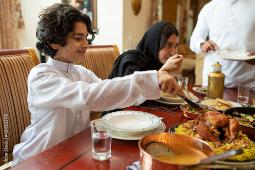 Arabian family having dinner, Arabian family eating iftar in Ramadan