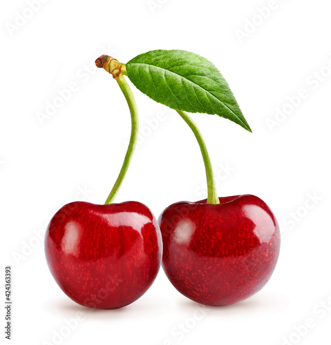 Two cherries with cherry leaf isolated on white.