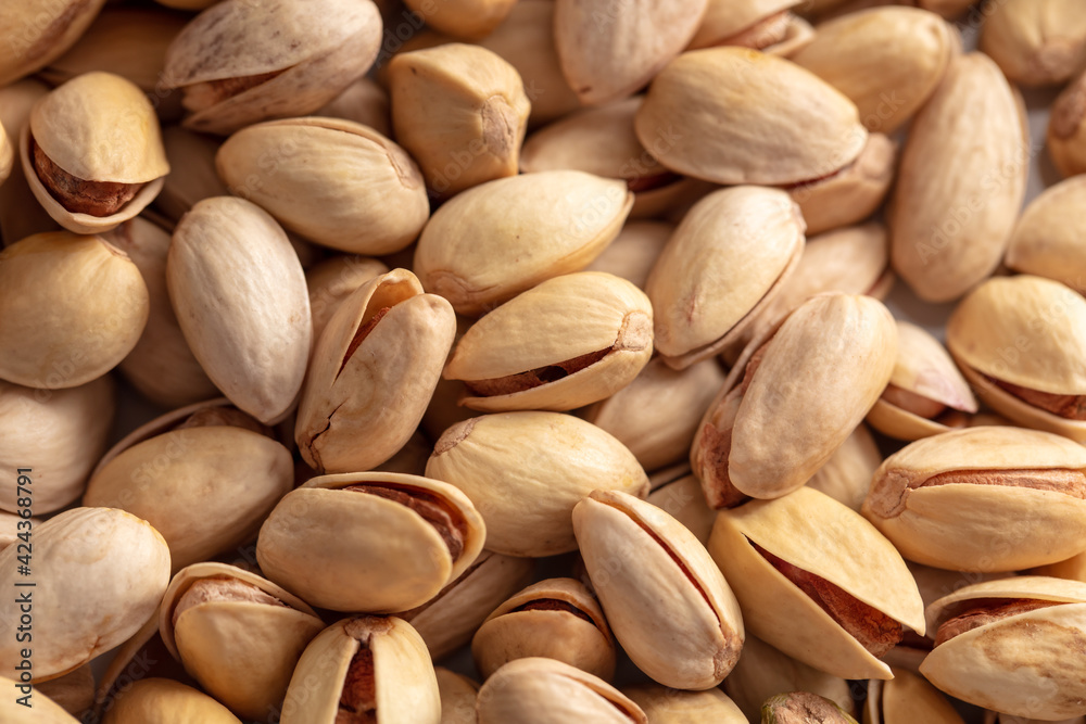 Close-up of fresh pistachio nuts as background. Close-up of fresh pistachio nuts as background.